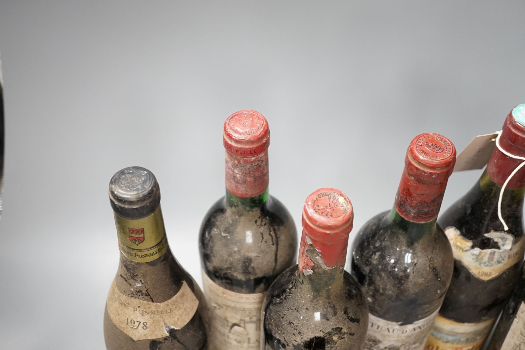 Six various bottles of red wine including two bottles of Château La Lagune 1976 etc.